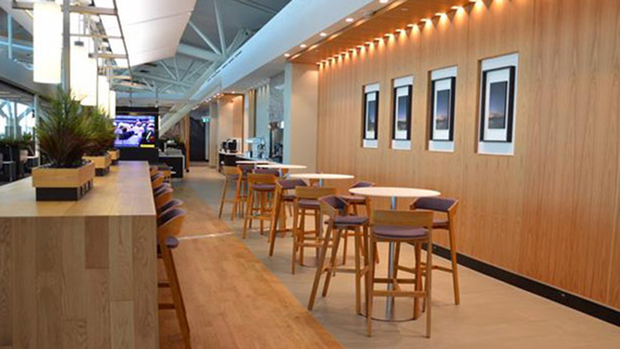 Bar height seating in Aspire Lounge Transborder in YYC