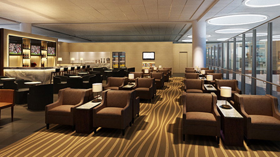 Comfortable seating in twos next to side table in Winnepeg Premium Lounge